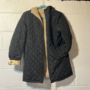 Black jacket with beige fuzzy liner